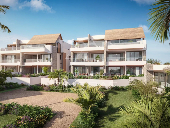 Exterior view of a luxury penthouse in a 5-star resort in Wolmar, surrounded by vegetation.