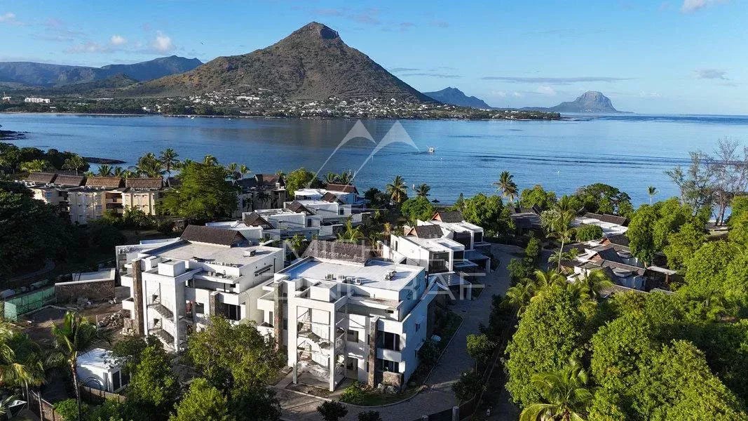Aerial view of a penthouse in a resort in Wolmar, with swimming pool and view of Le Morne Brabant.