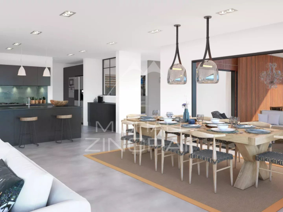 Intérieur d'une villa moderne avec salon, salle à manger et cuisine ouverte.