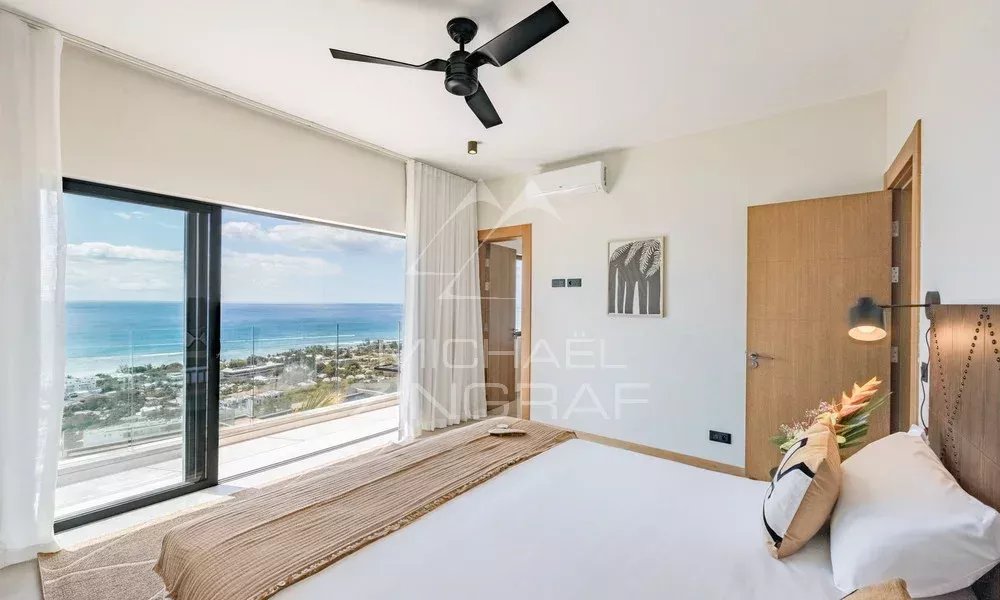 Chambre avec vue sur l’océan Chambre d'appartement avec vue sur l'océan et le Morne, décor moderne et lumineux.
