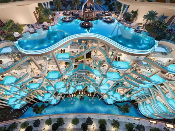 Vue aérienne d'une résidence de luxe à Dubaï avec piscine et espaces de détente.