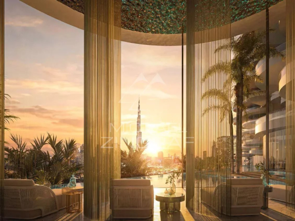 Intérieur d'une résidence de luxe à Dubaï avec vue sur le coucher de soleil et la Burj Khalifa.