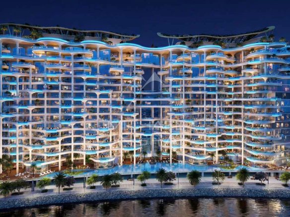Immeuble résidentiel moderne à Dubaï avec éclairage nocturne et piscine extérieure.