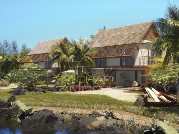 Duplex in Pointe d'Esny with swimming pool and garden, surrounded by greenery and lagoon.