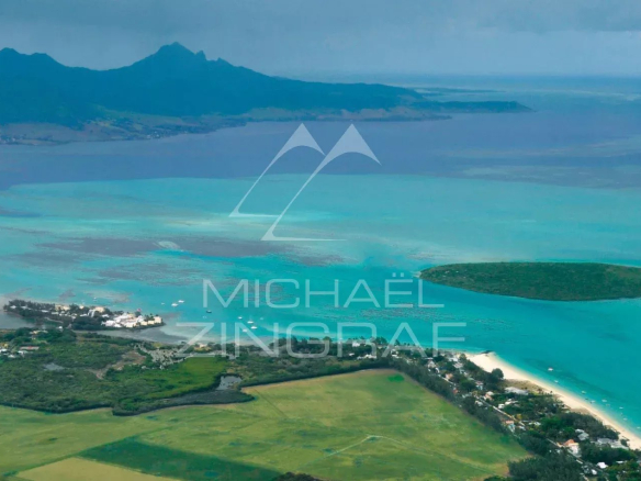Aerial view of Pointe d'Esny with lagoon and green landscapes.