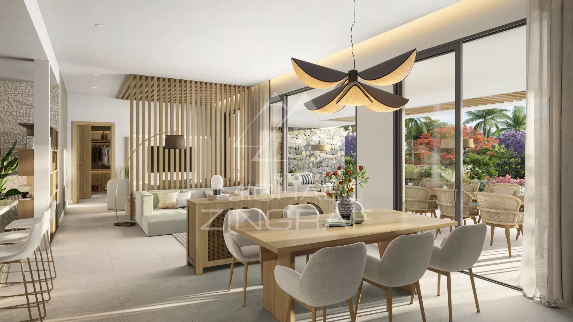 Appartement moderne à Balaclava Intérieur d'un appartement moderne avec salon et salle à manger, baies vitrées donnant sur un jardin tropical.