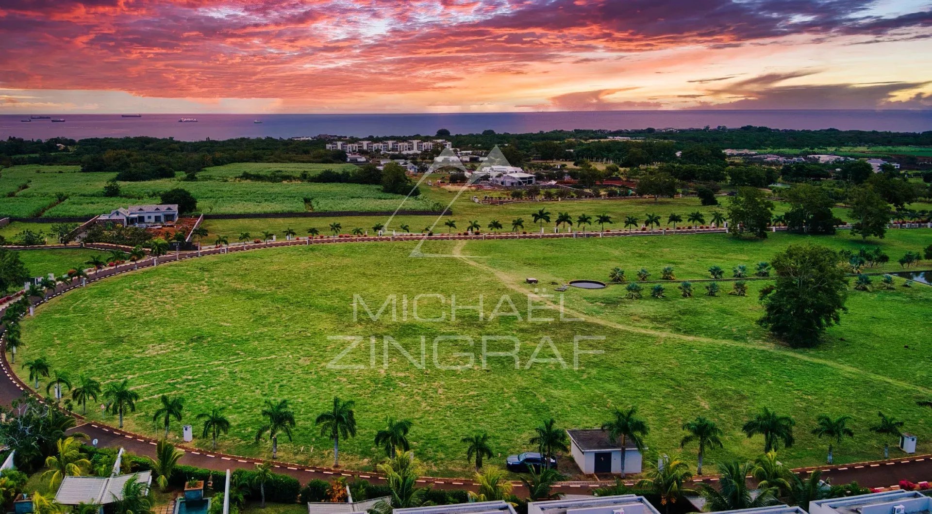 Panoramic view of Balaclava at sunset Aerial view of a verdant landscape with a sunset in Balaclava, surrounded by tropical gardens.