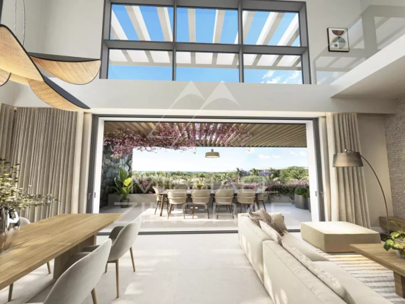 Interior of a modern penthouse with a bright living room and views of a tropical garden in Balaclava.
