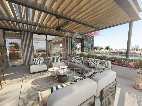 Terrace of a modern penthouse with elegant furniture and views of a tropical garden in Balaclava.