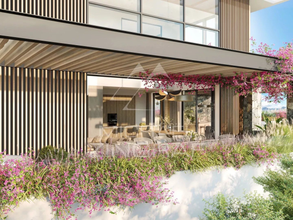 Terrace of a modern penthouse in Balaclava with flowers and an outdoor living space.