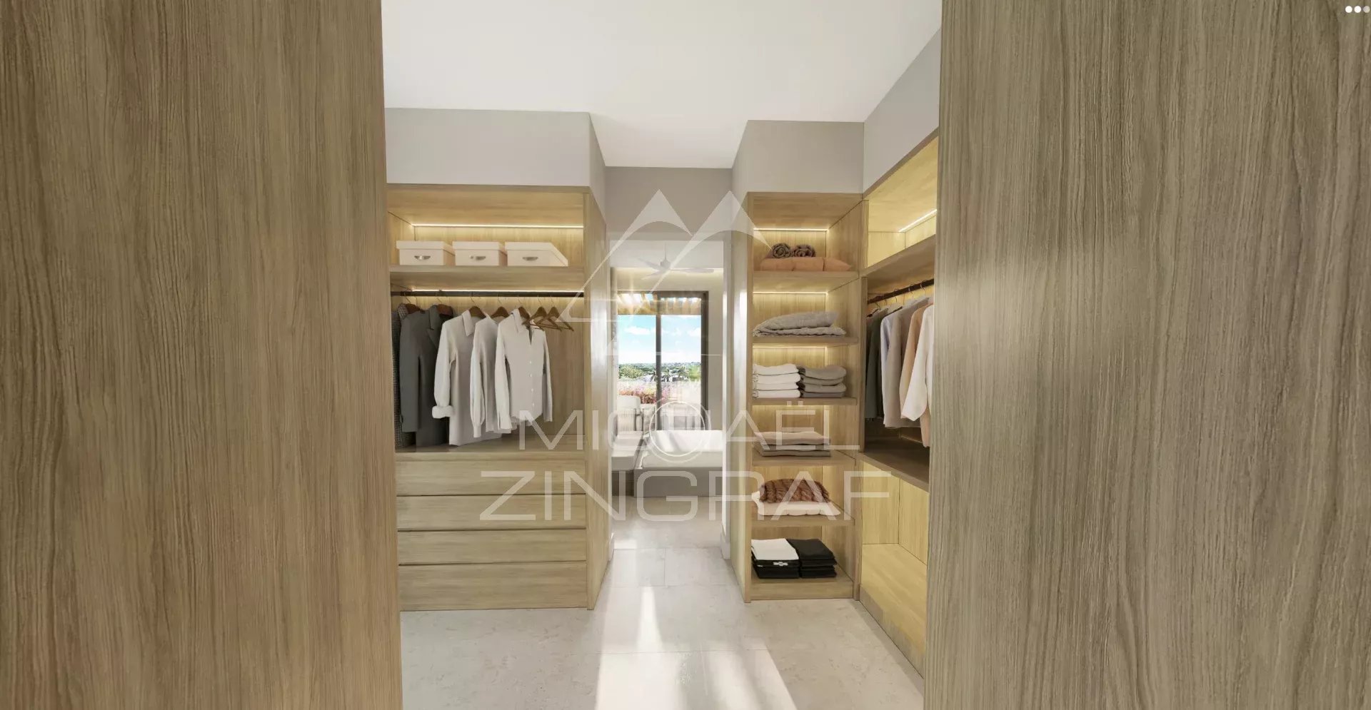 Modern dressing room in Balaclava Interior of a modern dressing room with well-organized clothes and accessories.