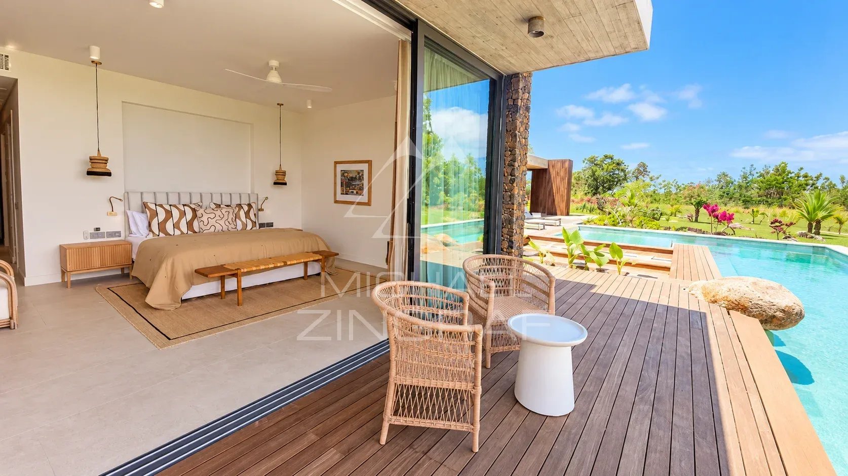 Room in a modern villa overlooking the private pool and tropical garden.