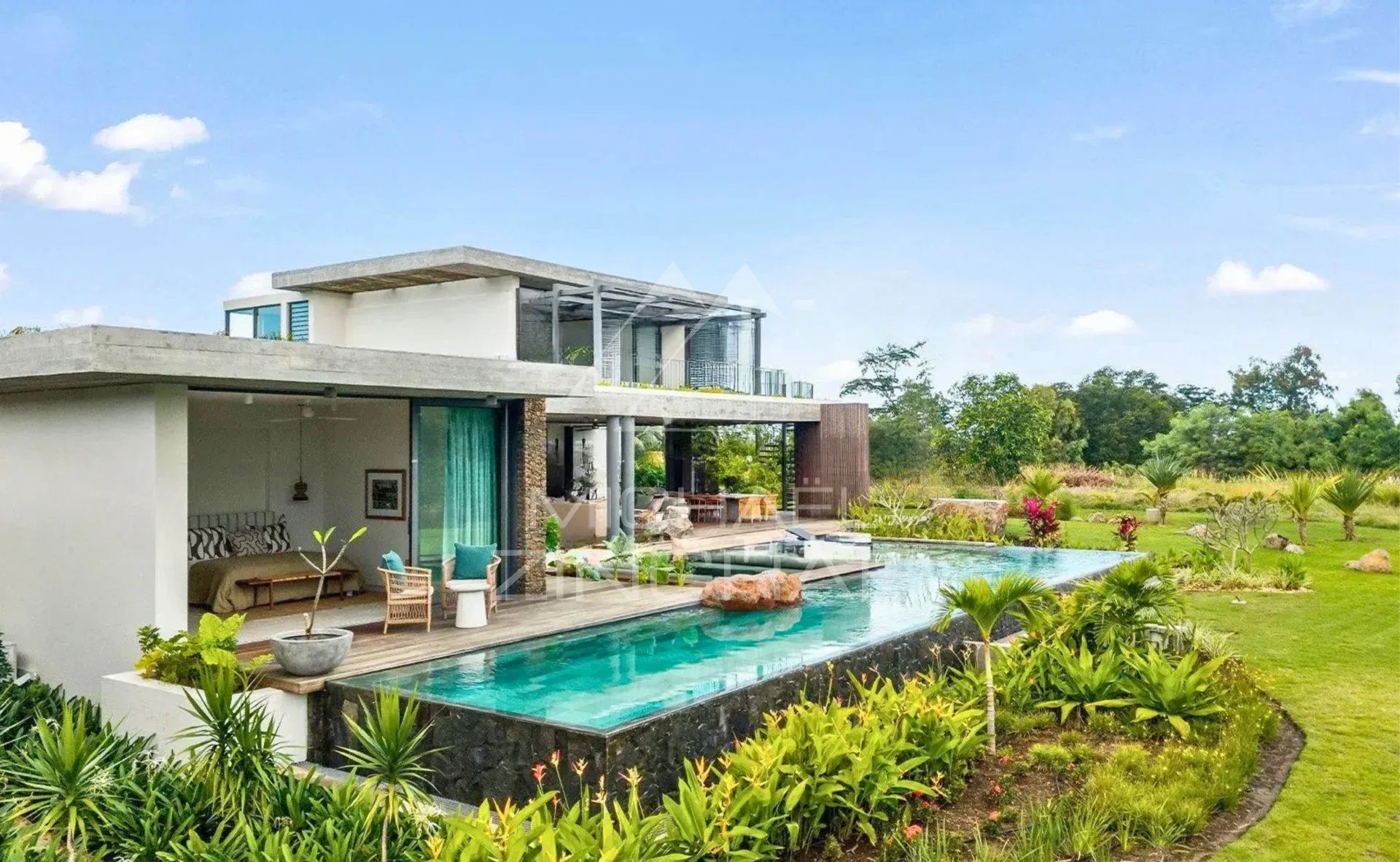 Modern villa with private pool and garden, located in a golf estate.