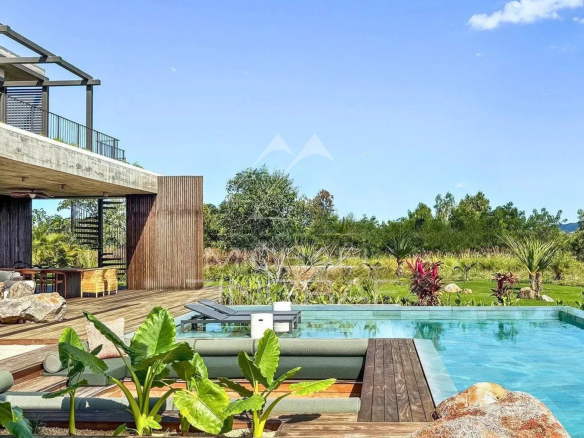 Modern villa with private pool and lush garden, located in the Anahita estate in Beau Champ.