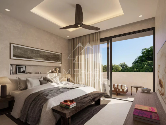Chambre moderne avec lit, balcon et vue sur la nature, dans une villa de luxe à Bel Ombre, Maurice.