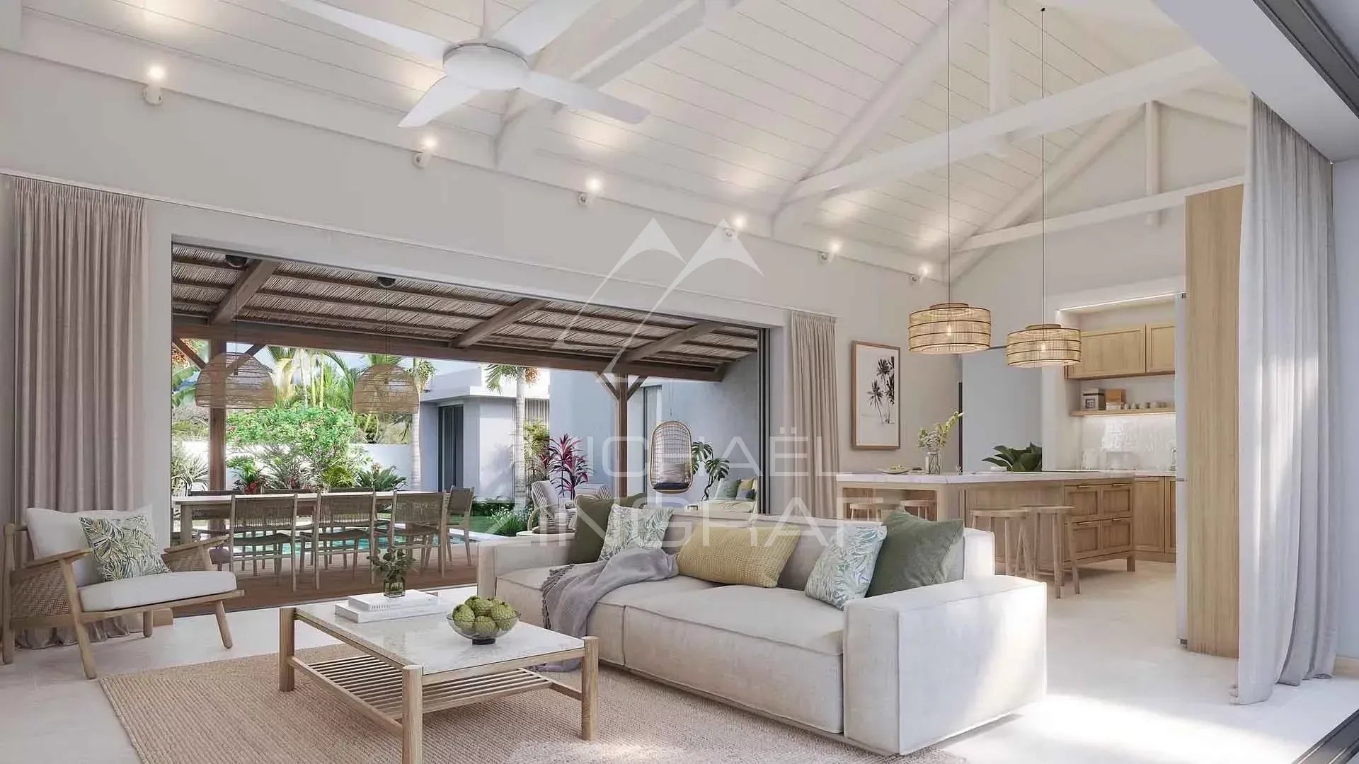 Intérieur d’une villa à Grand Baie Intérieur d'une villa moderne avec salon lumineux et cuisine ouverte à Grand Baie, Île Maurice.