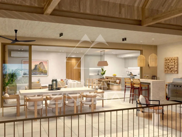 Intérieur d'un penthouse moderne avec salon, salle à manger et cuisine ouverte à Anse La Raie, Île Maurice.
