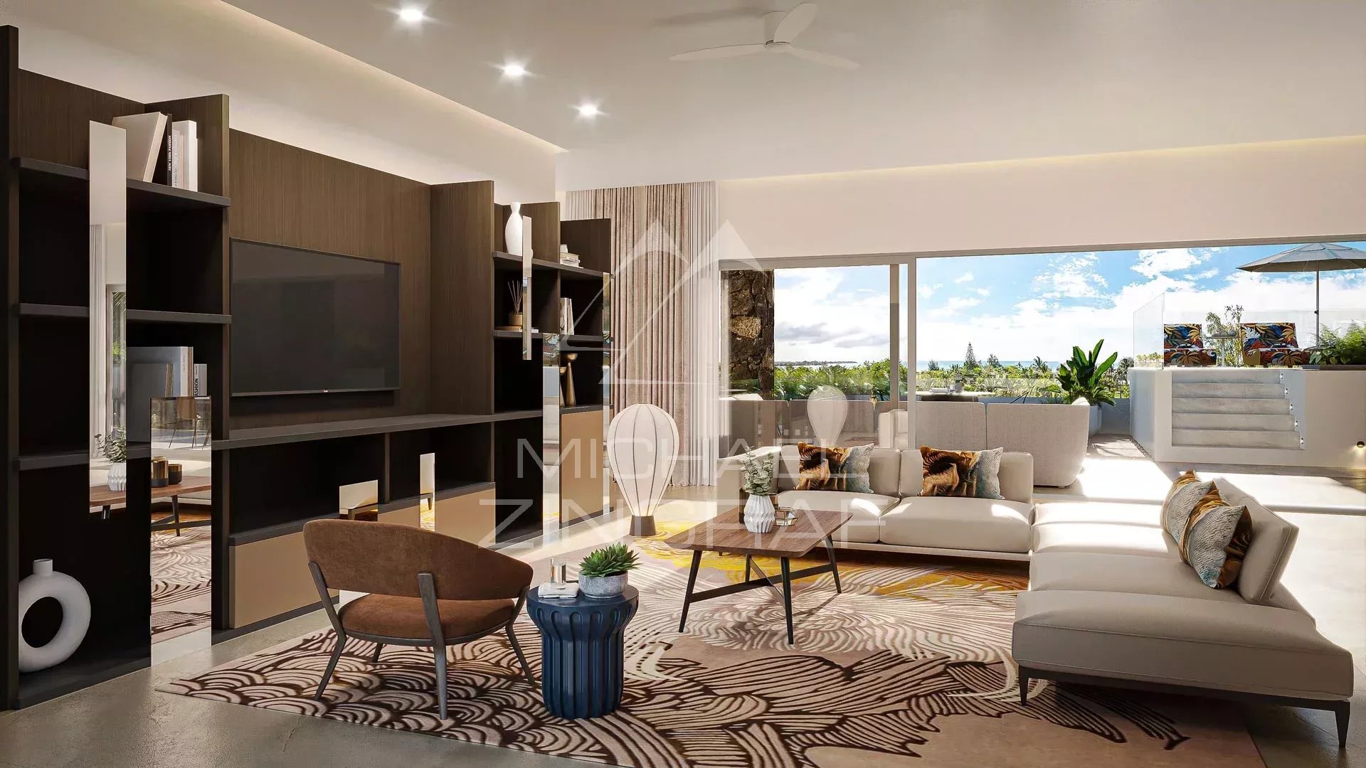 Intérieur d'un penthouse moderne avec salon lumineux et vue sur la mer à Pereybère.