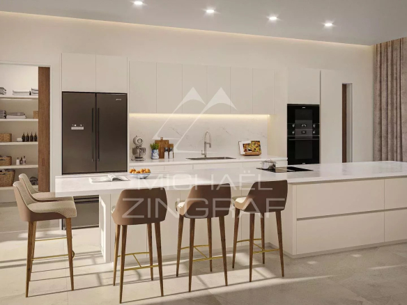 Cuisine moderne et spacieuse d'un penthouse à Pereybere avec îlot central et équipements haut de gamme.