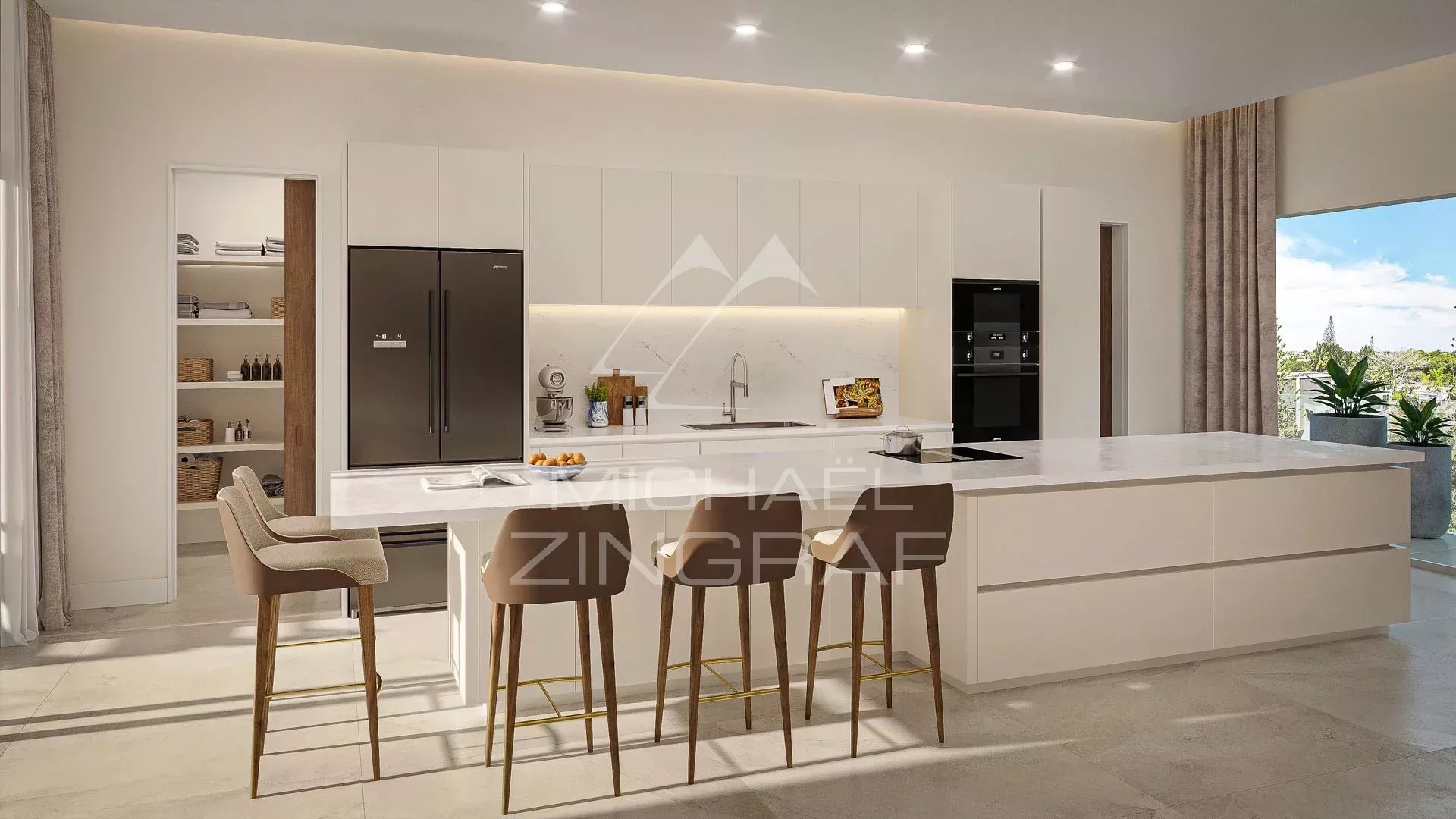 Cuisine moderne et spacieuse d'un penthouse à Pereybere avec îlot central et équipements haut de gamme.