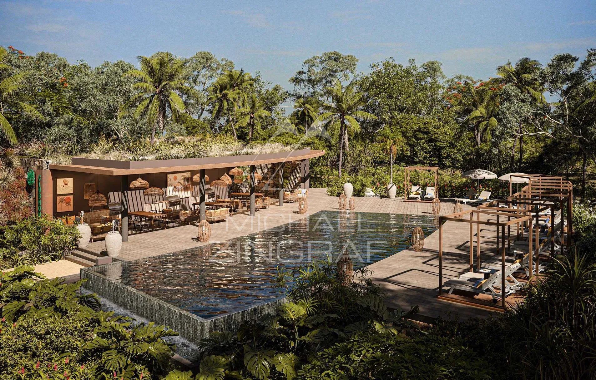 Villas de luxe avec piscine et jardin à Anse La Raie, Île Maurice, entourées de nature.