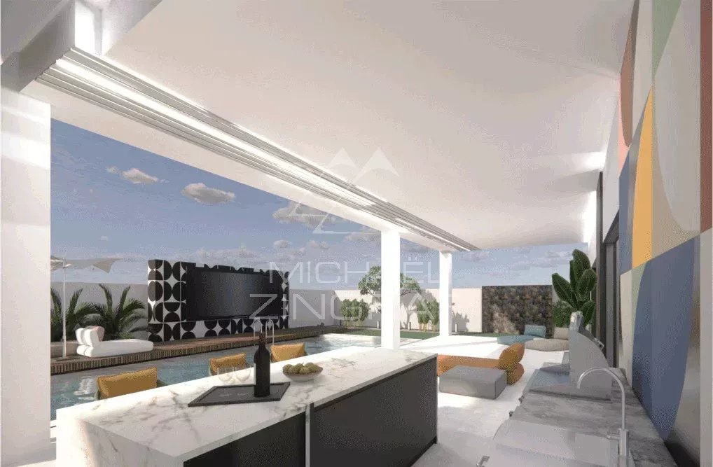 Intérieur de la villa LENI à Grand Baie Intérieur moderne d'une villa avec cuisine ouverte et vue sur la piscine.