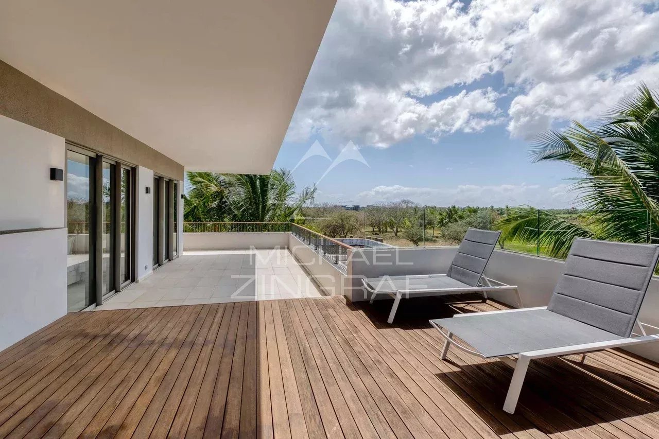 Penthouse terrace in Mont Choisy Terrace of a contemporary penthouse with sun loungers and golf course views in Mont Choisy, Grand Baie.