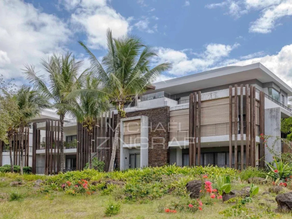 Contemporary penthouse with golf views in Mont Choisy, Grand Baie, surrounded by palm trees.