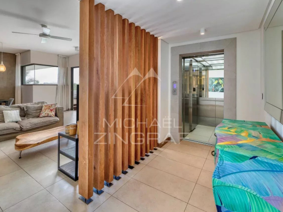 Interior of a contemporary penthouse with living room and private elevator in Mont Choisy, Grand Baie.