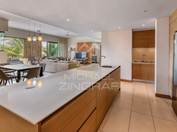 Interior of a contemporary penthouse with open kitchen and spacious living room.