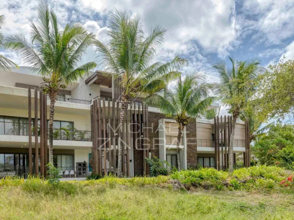 Exterior view of a contemporary penthouse with palm trees and garden in Mont Choisy, Grand Baie.