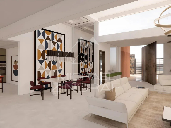 Intérieur d'une villa de luxe à Grand Baie avec un salon moderne et une cuisine ouverte.