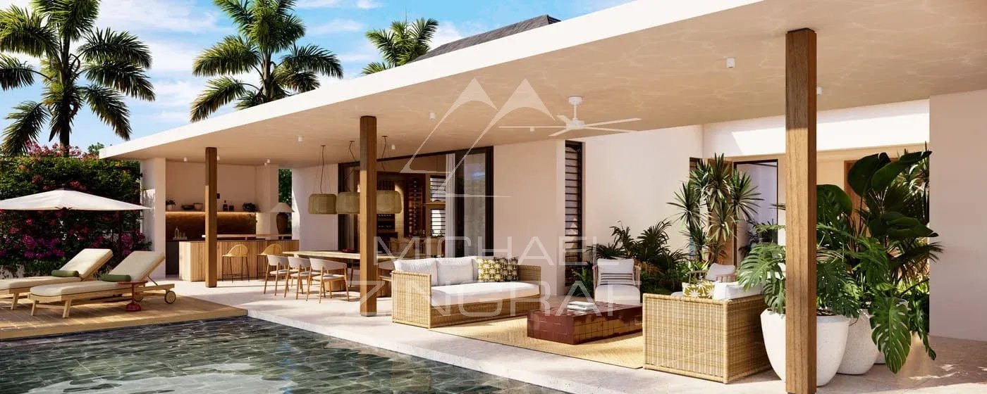 Villa Vacoas à Bel Ombre Terrasse d'une villa moderne avec piscine, meubles en rotin et plantes, à Bel Ombre.