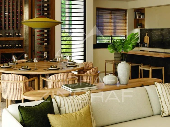 Intérieur moderne de la Villa Vacoas avec salle à manger et cuisine ouverte.