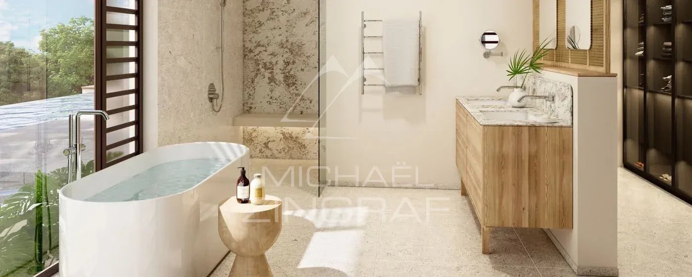 Salle de bain de la Villa Vacoas Salle de bain moderne avec baignoire, lavabo et décoration en bois et pierre.
