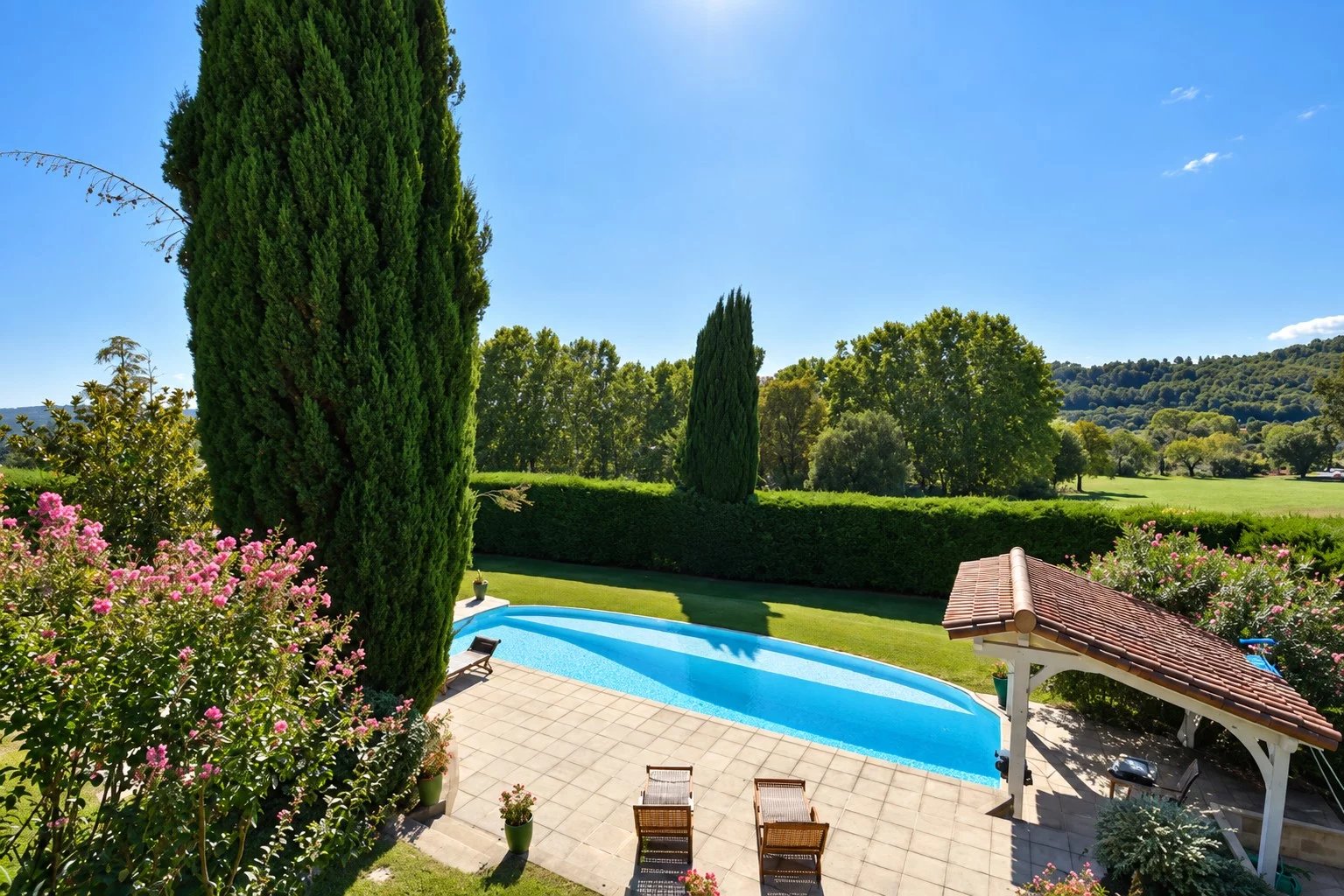 Property with infinity pool in Callian View of an infinity pool surrounded by greenery and flowers in Callian.