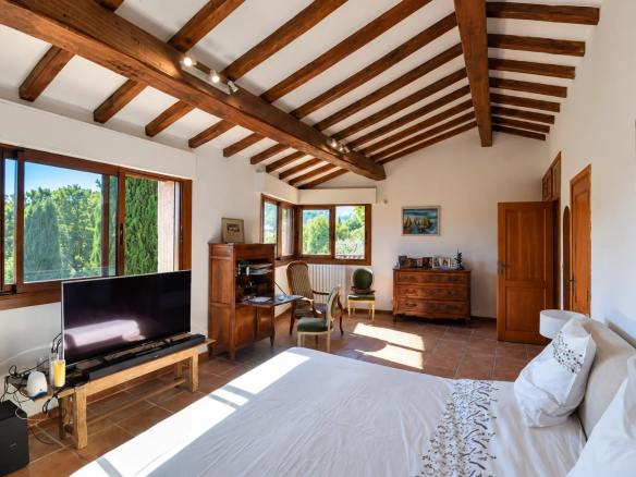 Bright room with wooden ceiling and nature view, Callian.