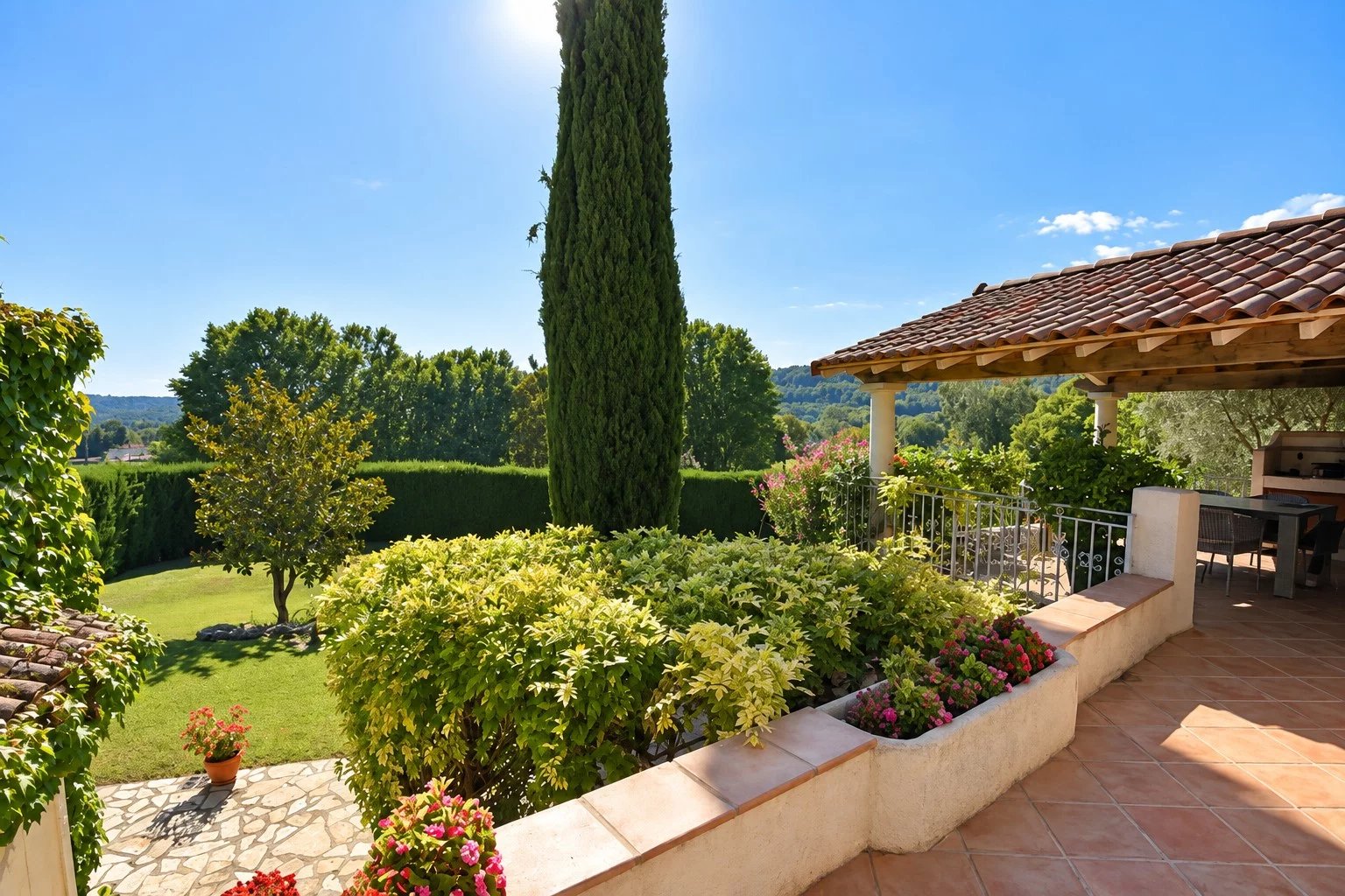Character property in Callian View of a property with garden, terraces and swimming pool in Callian, sunny with green spaces.