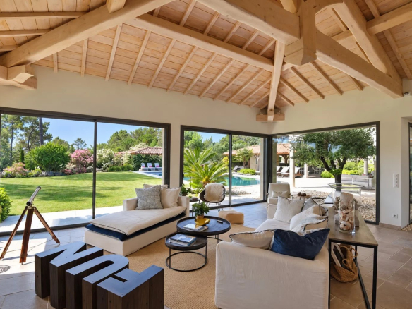 Interior of a contemporary villa overlooking the garden and swimming pool in Tourrettes.