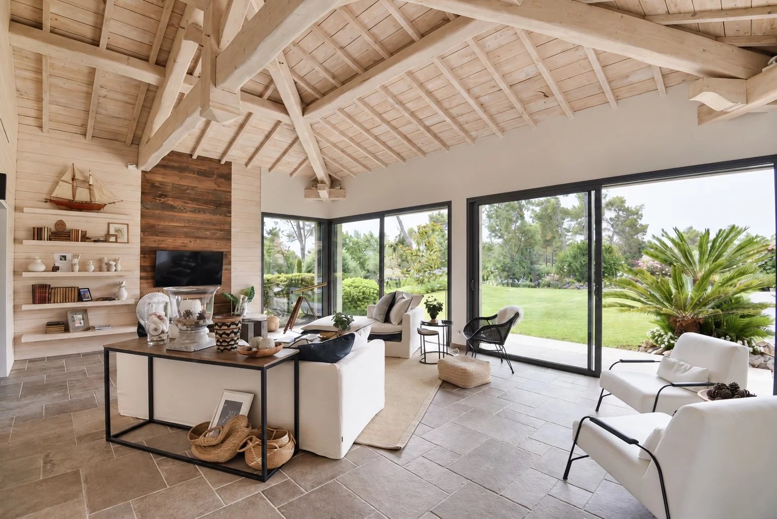 Interior of a villa in Tourrettes Interior of a contemporary villa with a bright living room and garden view.