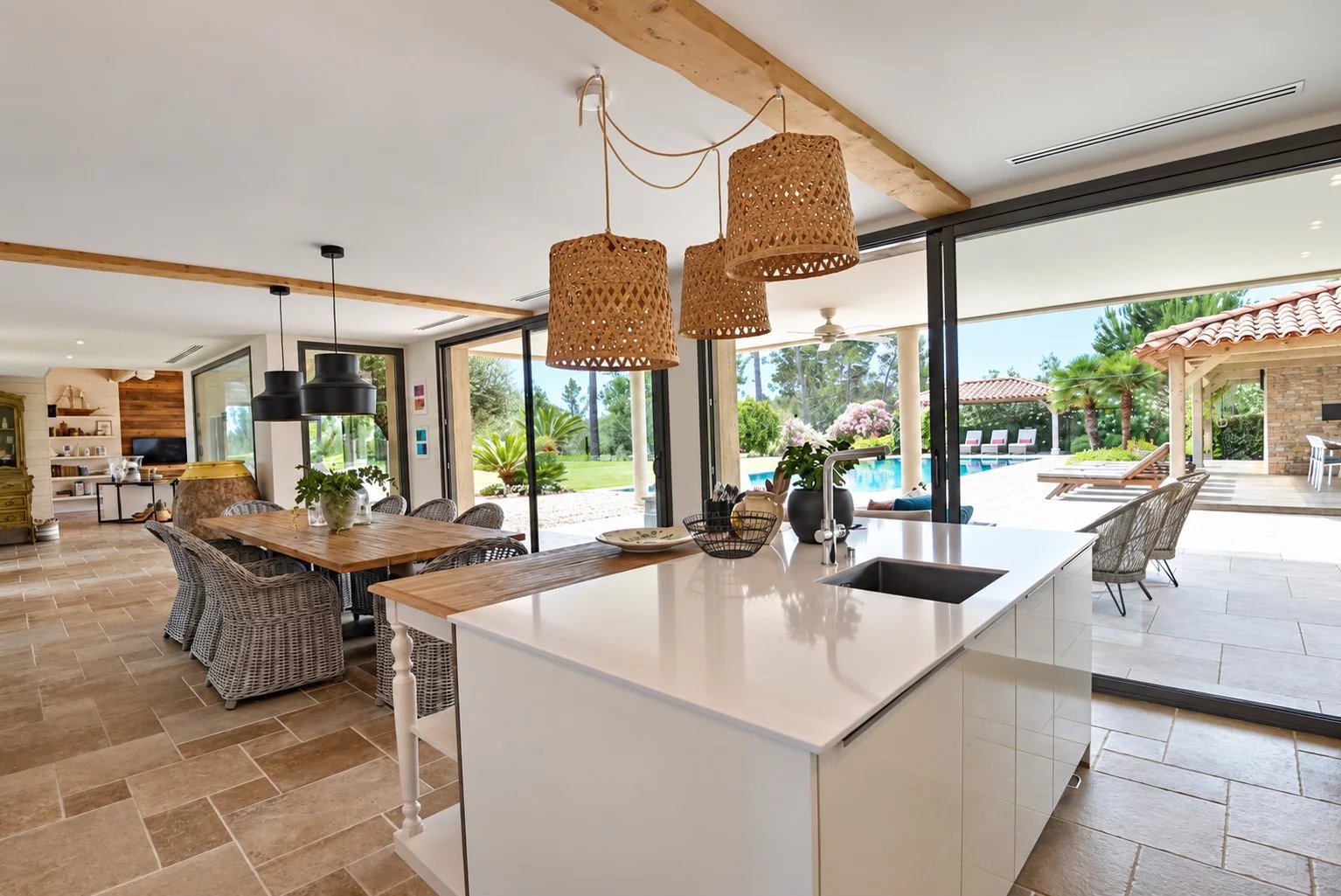 Interior of the luxury villa in Tourrettes Interior of a contemporary villa with open kitchen and view of the outdoor pool in Tourrettes.