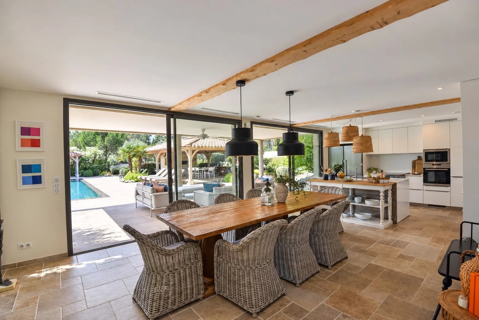 Interior of a luxury villa in Tourrettes Interior of a contemporary villa with dining room and view of the outdoor pool in Tourrettes.