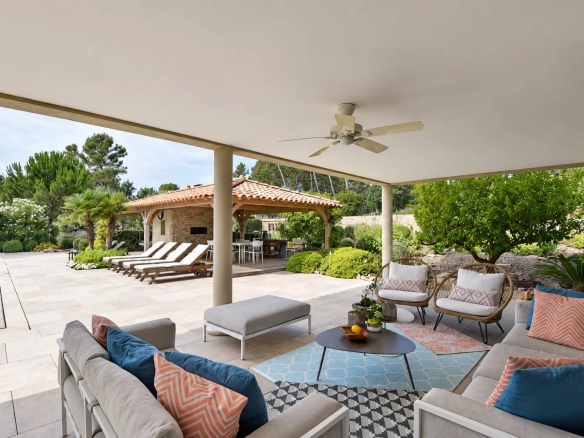 Terrace of a luxury villa with outdoor lounge, swimming pool and pool house in Tourrettes.