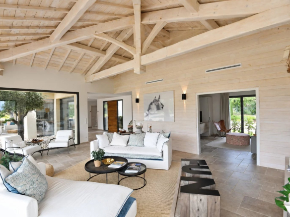 Interior of a contemporary villa with a spacious living room and refined decor in Tourrettes.