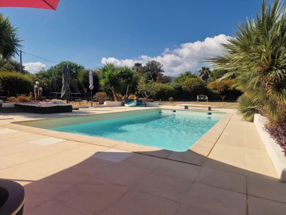Swimming pool of a villa with landscaped garden in the Marina of Solaro, Corsica.