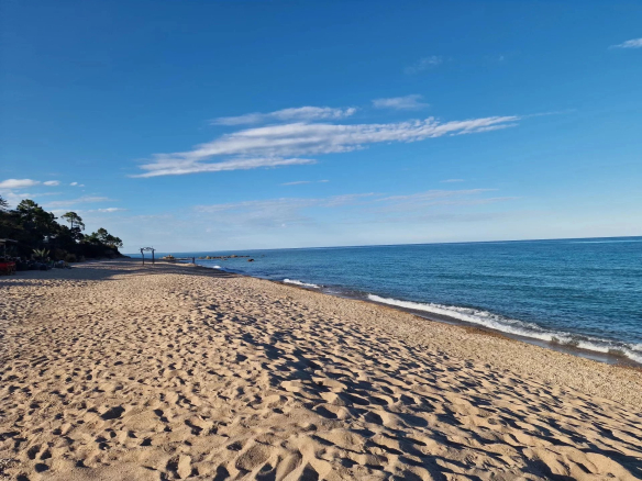 Fine sandy beach with calm sea at Marine de Solaro, Corsica.
