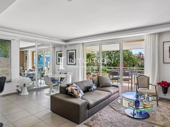 Interior of a modern apartment with living room, dining room and large terrace, unobstructed view.