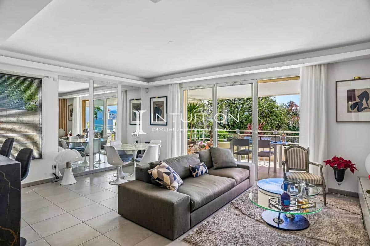 Interior of a modern apartment with living room, dining room and large terrace, unobstructed view.