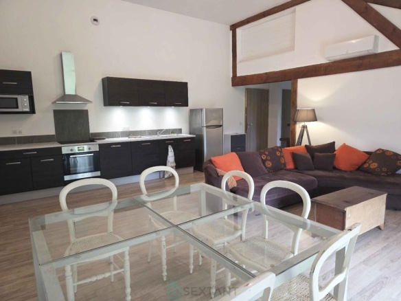 Interior of a property with modern kitchen and comfortable living room in Saint-Jean-de-Marsacq.