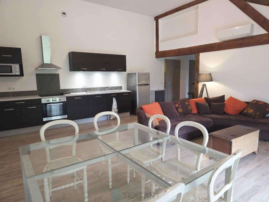 Interior of a property with modern kitchen and comfortable living room in Saint-Jean-de-Marsacq.